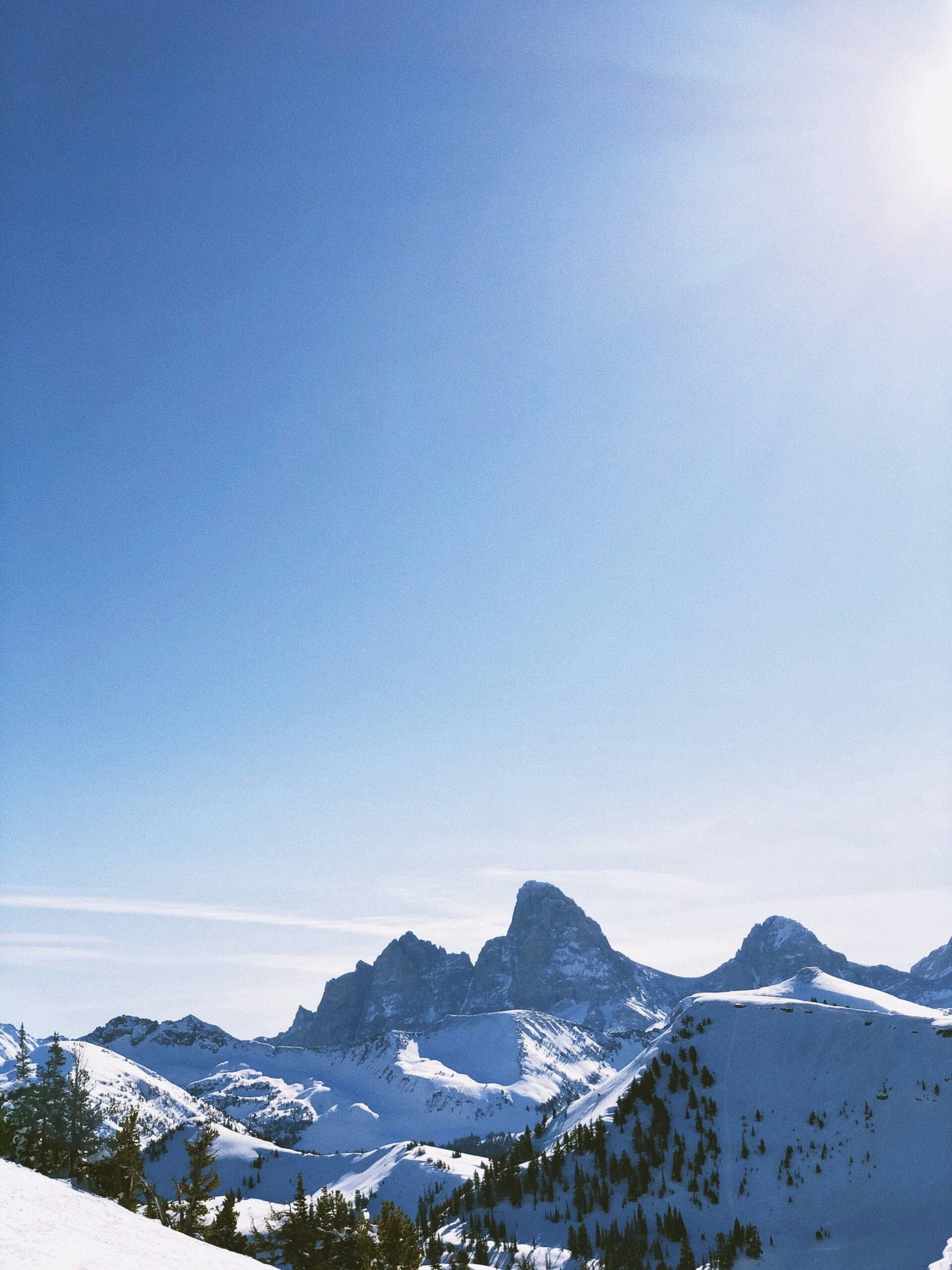 snow covered mountain under blue sky during daytime