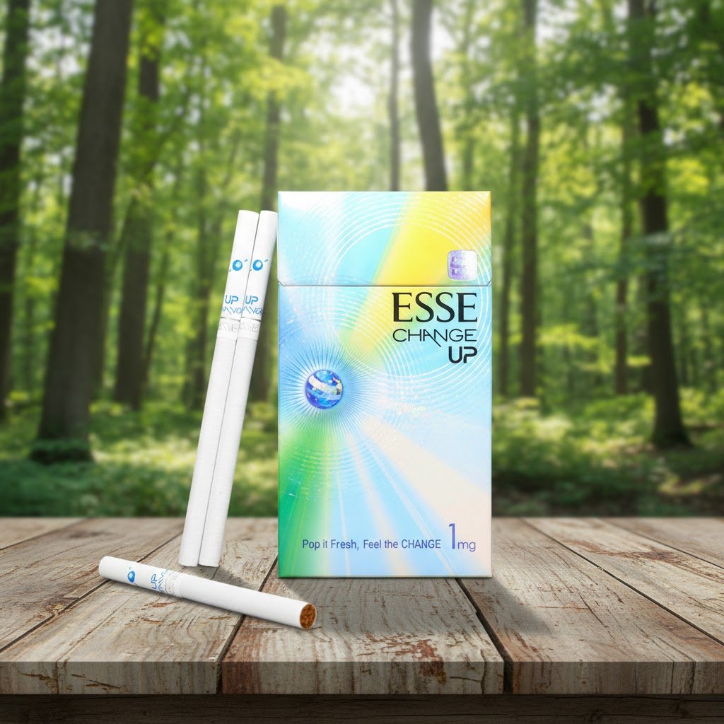 กล่องบุหรี่ ESSE Change Up 1mg สีรุ้งพาสเทลสดใส วางบนโต๊ะไม้ในบรรยากาศสวนป่า